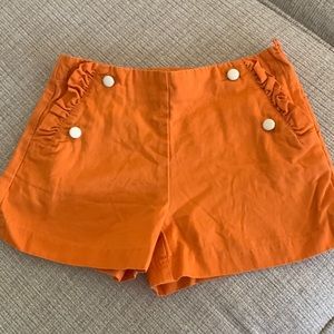 Janie and Jack Orange with white / gold button Shorts - size 10